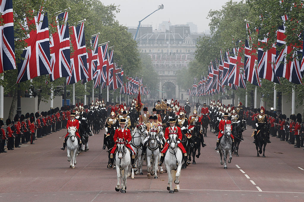 LONDON, ENGLAND - APRIL 29: A general view of the carriage procession to Buckingham Palace following the marriage of TRH Prince William, Duke of Cambridge and Catherine, Duchess of Cambridge at Westminster Abbey on April 29, 2011 in London, England. The marriage of the second in line to the British throne was led by the Archbishop of Canterbury and was attended by 1900 guests, including foreign Royal family members and heads of state. Thousands of well-wishers from around the world have also flocked to London to witness the spectacle and pageantry of the Royal Wedding. (Photo by Christopher Furlong/Getty Images)