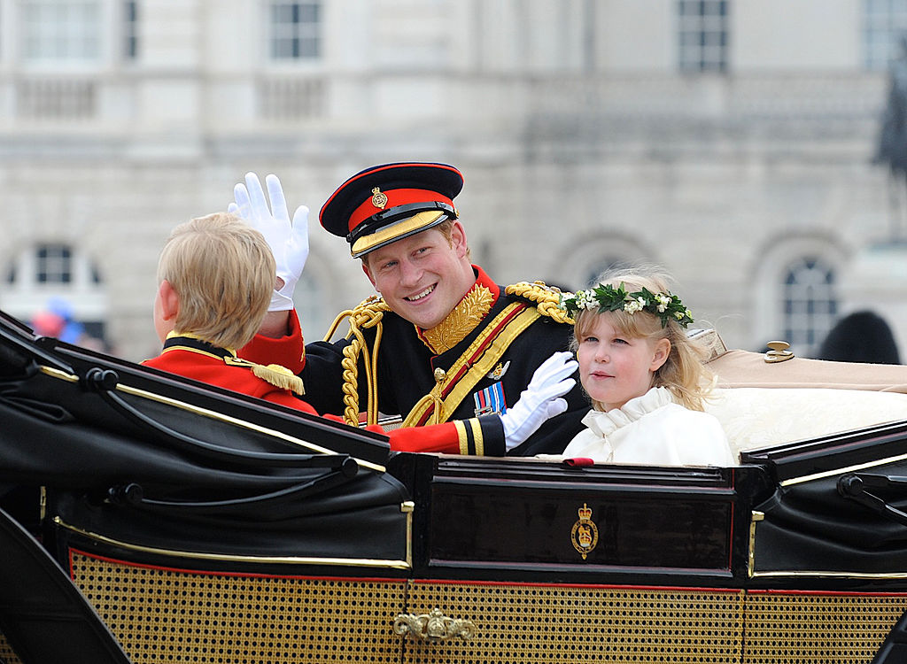 LONDON, ENGLAND - APRIL 29: In this handout image provided by Crown Copyright, Prince Harry waves to the crowd as they make the journey by carriage procession to Buckingham Palace following their marriage at Westminster Abbey on April 29, 2011 in London, England. The marriage of the second in line to the British throne was led by the Archbishop of Canterbury and was attended by 1900 guests, including foreign Royal family members and heads of state. Thousands of well-wishers from around the world have also flocked to London to witness the spectacle and pageantry of the Royal Wedding. (Sergeant Dan Harmer RLC/Mandatory Credit MOD/Crown Copyright via Getty Images)