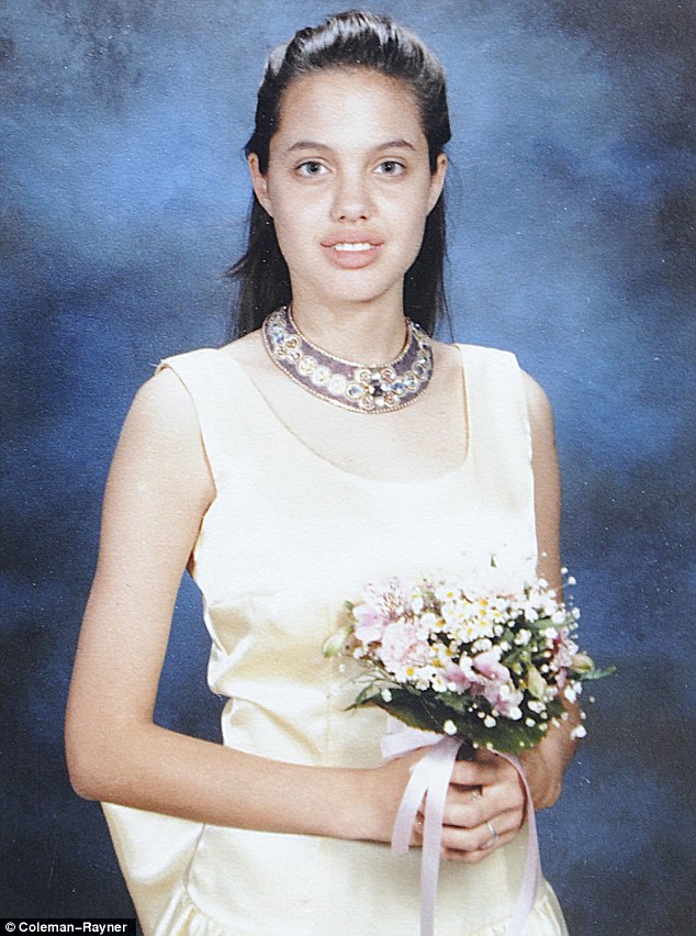 Growing up: Angelina Jolie wears a satin dress for her eighth grade graduation, aged around 14