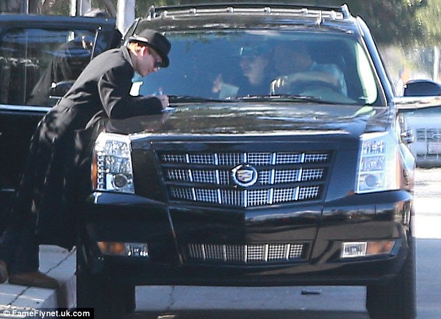 Like any other parent: But Johnny signed the paper on his posh Escalade