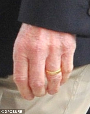 Band together: The 69-year-old was sporting his wedding ring