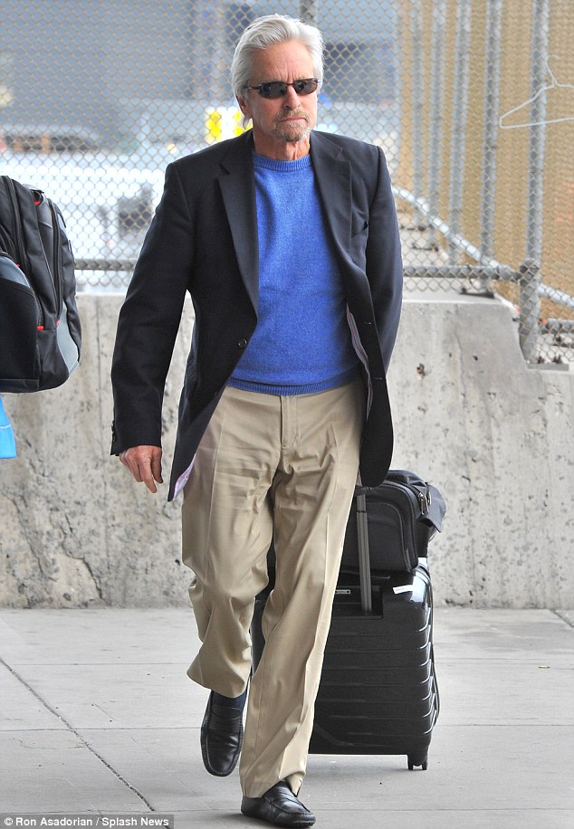 Man on the go: Michael Douglas returned to New York on Monday, just two days after departing with wife Catherine Zeta-Jones and daughter Carys