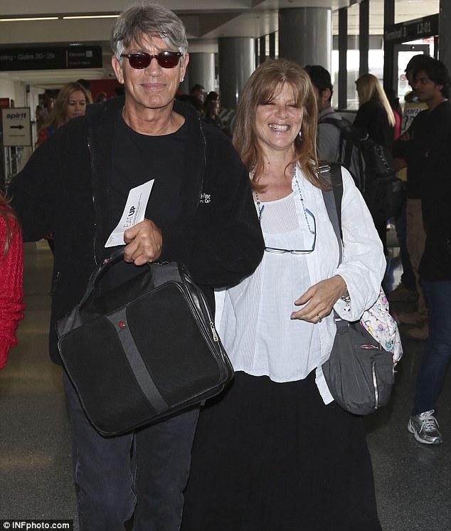 Headed out: Eric Roberts and his wife Eliza departed Los Angeles International Airport on Thursday