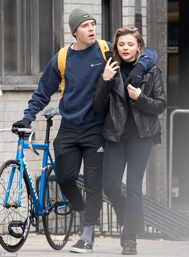 Sweet: The 18-year-old was seen wrapping an affectionate arm around the blonde beauty, 20, as the pair enjoyed a low-key afternoon together in the Big Apple as he walked along with the break-free cycle, a product which are banned in his native UK
